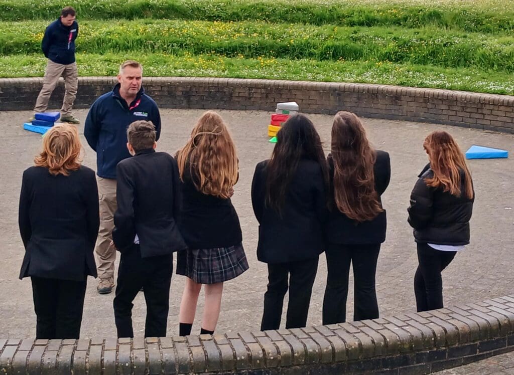 Instructor Chris engaging a mix of students in a fun activity.